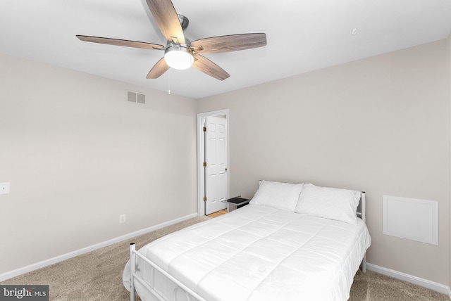 carpeted bedroom with baseboards and a ceiling fan