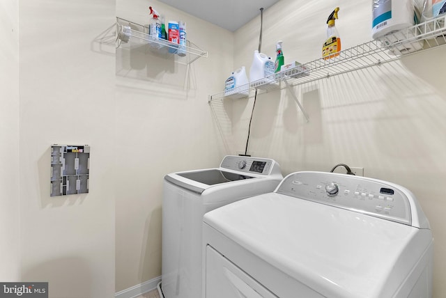 laundry room with separate washer and dryer