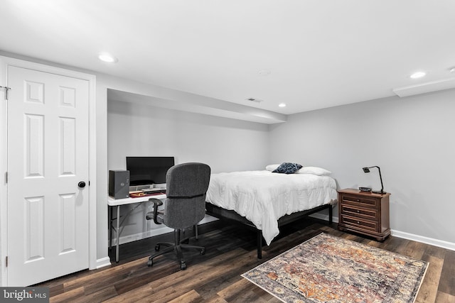 bedroom with recessed lighting, dark wood-style flooring, and baseboards