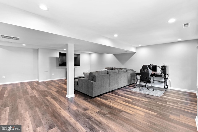 living area featuring dark wood-style flooring, baseboards, and recessed lighting