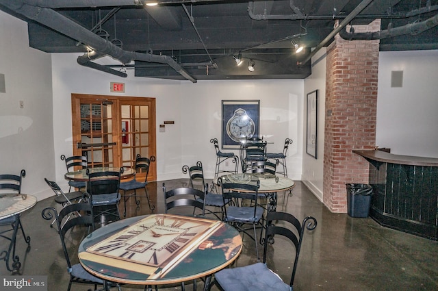 dining area with visible vents and finished concrete floors