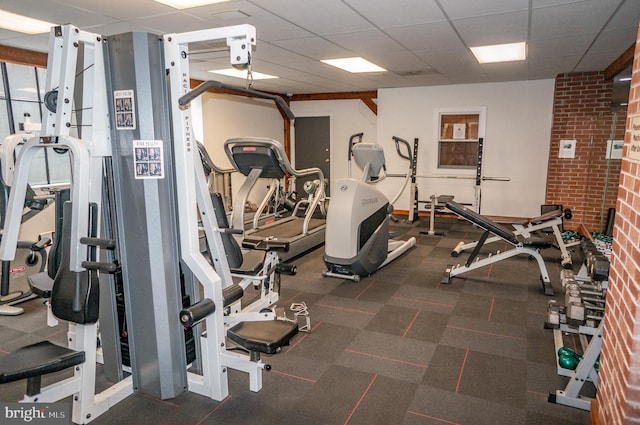 gym with a drop ceiling