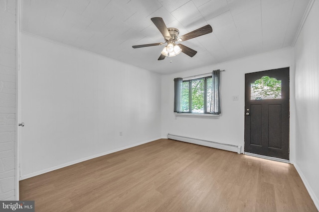 foyer entrance featuring baseboard heating, wood finished floors, ceiling fan, and crown molding