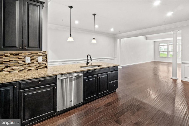 kitchen with a sink, crown molding, dark cabinetry, and dishwasher