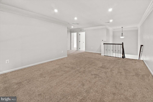 empty room with ornamental molding, carpet, recessed lighting, and visible vents