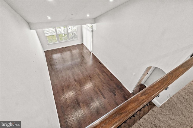 interior space with recessed lighting, baseboards, and wood finished floors