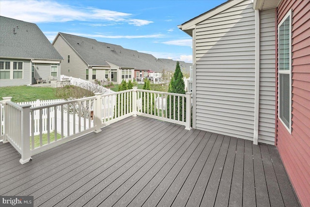 wooden deck with a residential view