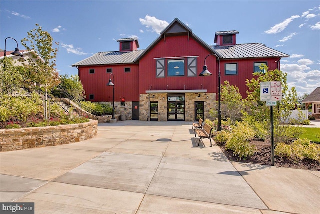 view of front of house featuring a standing seam roof and metal roof