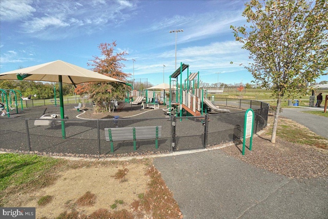 communal playground featuring fence