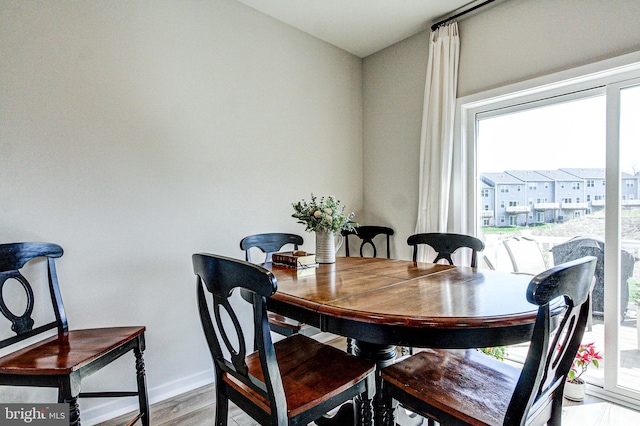 dining room featuring baseboards