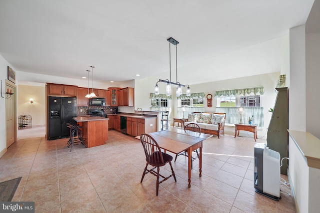 dining space with recessed lighting, baseboards, a chandelier, and light tile patterned floors
