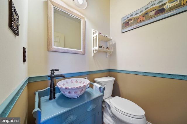 half bath with vanity and toilet