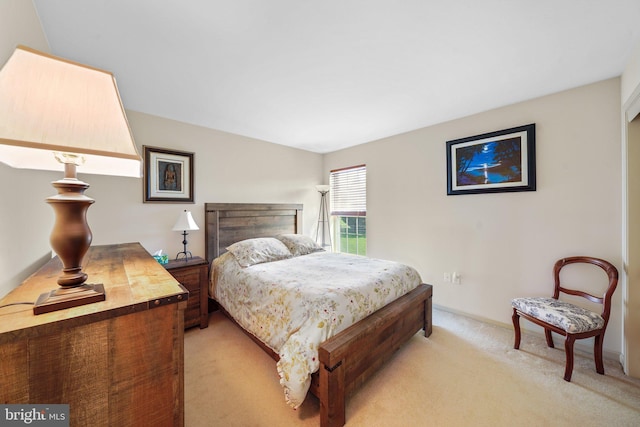 bedroom with light carpet