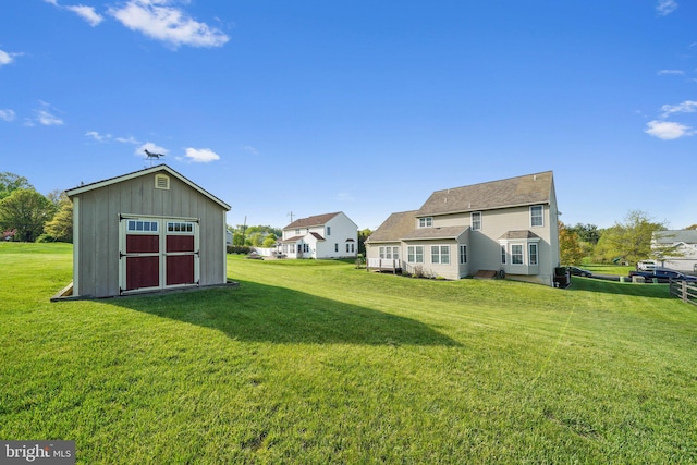view of yard with a storage shed and an outdoor structure