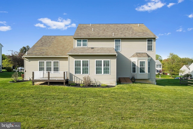 back of property with a lawn