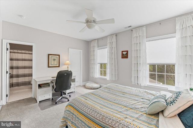 bedroom featuring visible vents, ceiling fan, and carpet