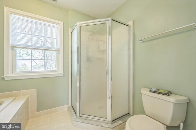 full bath featuring tile patterned floors, toilet, a stall shower, and baseboards
