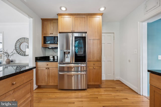 kitchen with recessed lighting, black microwave, stainless steel fridge with ice dispenser, and light wood-style floors