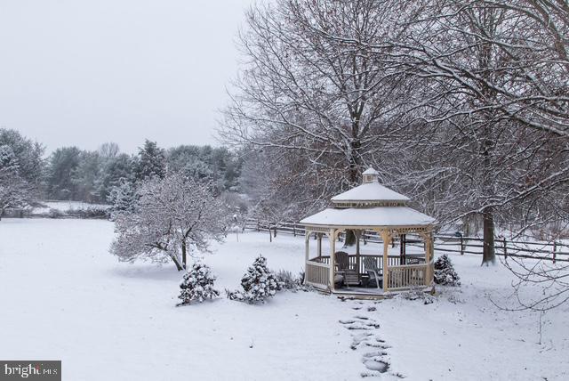 view of community with a gazebo and fence