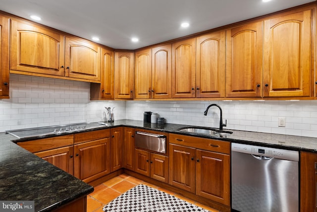 913 Spruce St, Philadelphia, PA 19107 - kitchen featuring stainless steel dishwasher, a sink, a warming drawer, decorative backsplash, and brown cabinetry