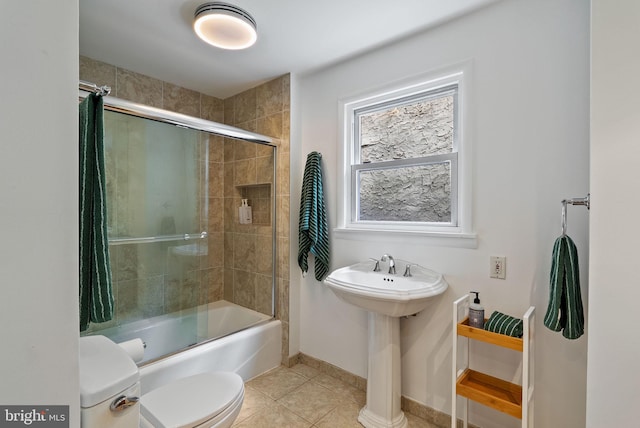 913 Spruce St, Philadelphia, PA 19107 - full bath featuring toilet, enclosed tub / shower combo, tile patterned floors, baseboards, and a sink