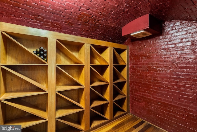 913 Spruce St, Philadelphia, PA 19107 - wine area with brick ceiling, brick wall, and wood finished floors