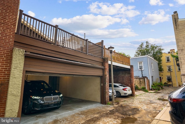 913 Spruce St, Philadelphia, PA 19107 - view of side of home with an attached garage and brick siding
