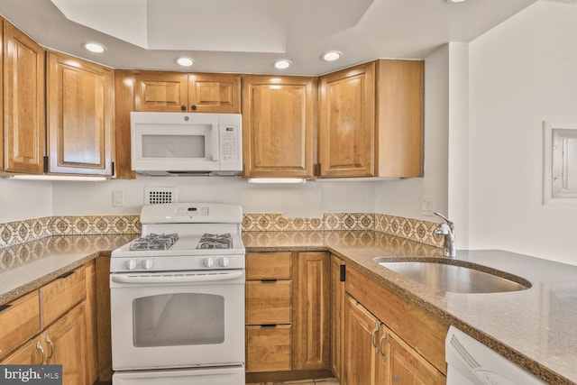 4515 Willard Ave Unit 1710S, Chevy Chase, MD 20815 - kitchen with white appliances, recessed lighting, light stone countertops, and a sink