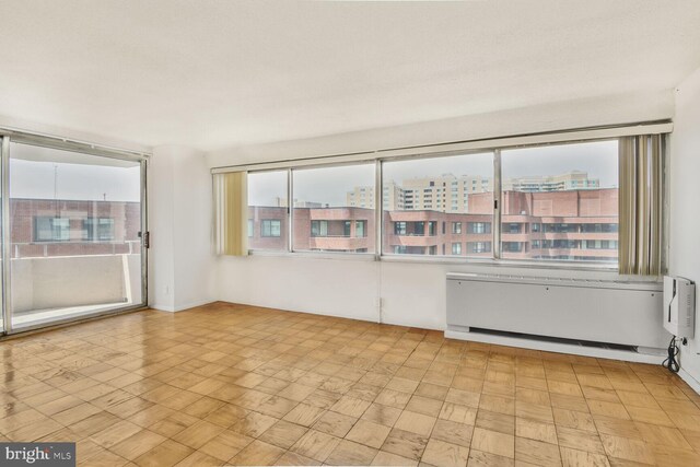 4515 Willard Ave Unit 1710S, Chevy Chase, MD 20815 - empty room featuring radiator heating unit and light floors