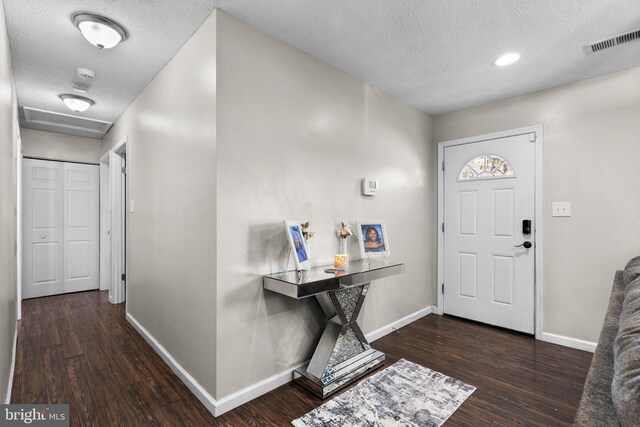 10205 Queen Elizabeth Dr, Upper Marlboro, MD 20772 - foyer with baseboards, visible vents, wood finished floors, and a textured ceiling