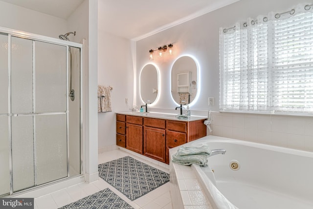 full bath with a jetted tub, tile patterned floors, a shower stall, and double vanity