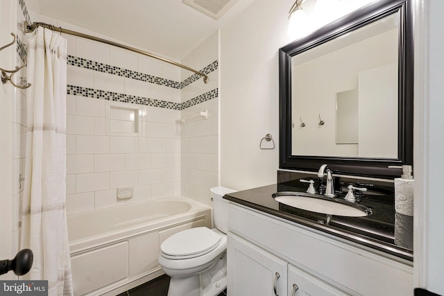 bathroom with toilet, vanity, visible vents, and shower / bathtub combination with curtain