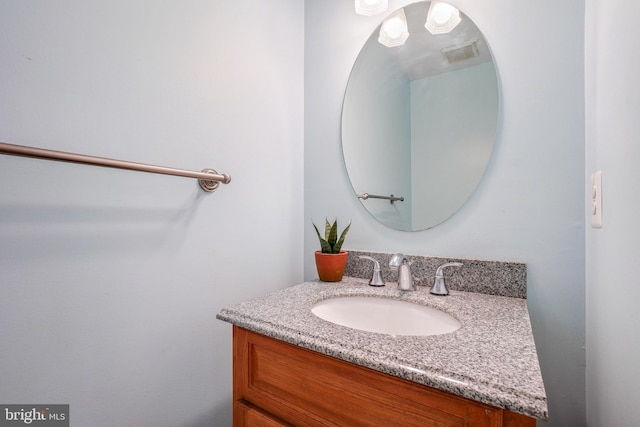 bathroom with vanity and visible vents