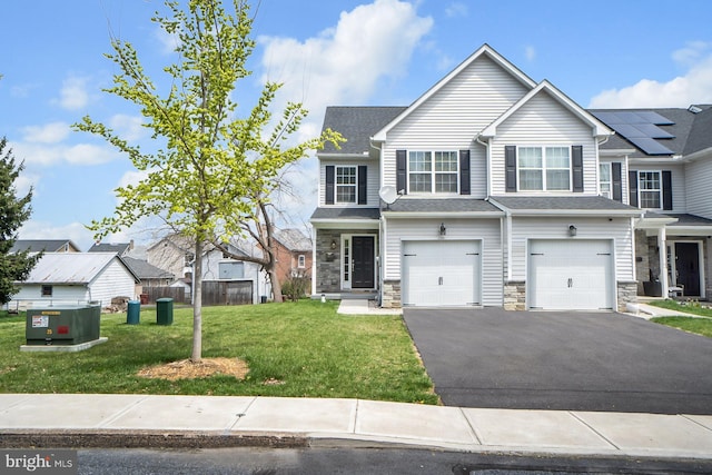 3022 S 3rd St, Whitehall, PA 18052 - multi unit property with a garage, stone siding, a front lawn, and aphalt driveway