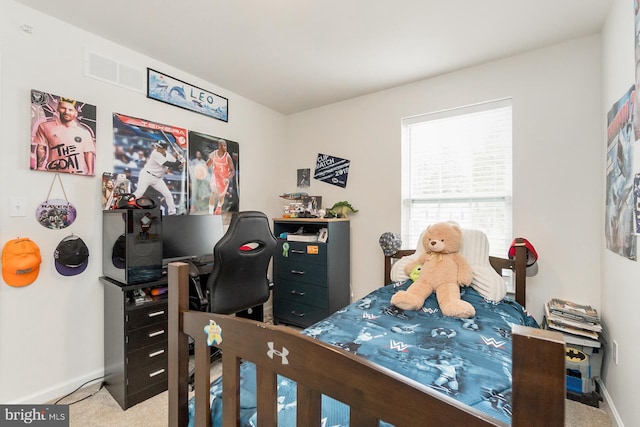 carpeted bedroom featuring baseboards