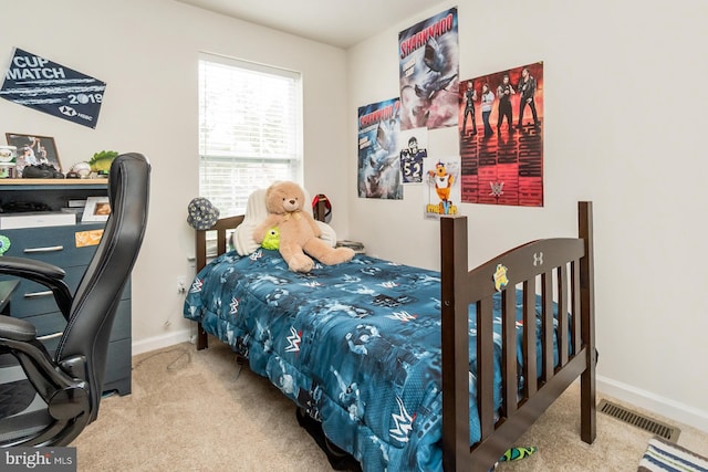 bedroom featuring baseboards, visible vents, and carpet