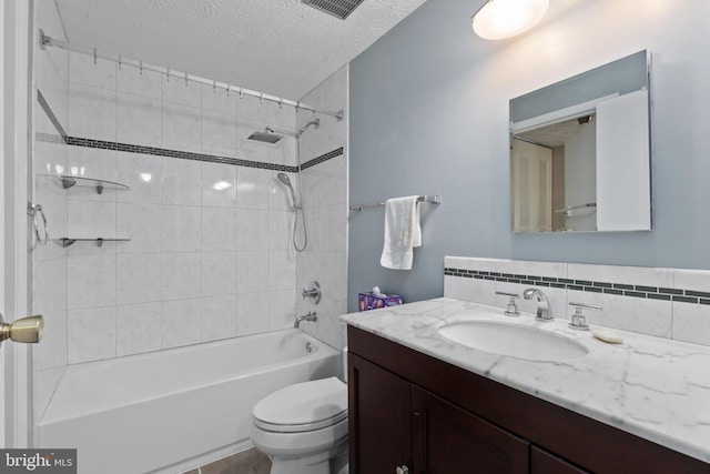 full bathroom featuring shower / tub combination, vanity, toilet, backsplash, and a textured ceiling