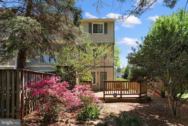 view of yard with a deck and fence