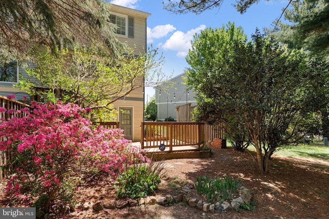 view of yard with a wooden deck