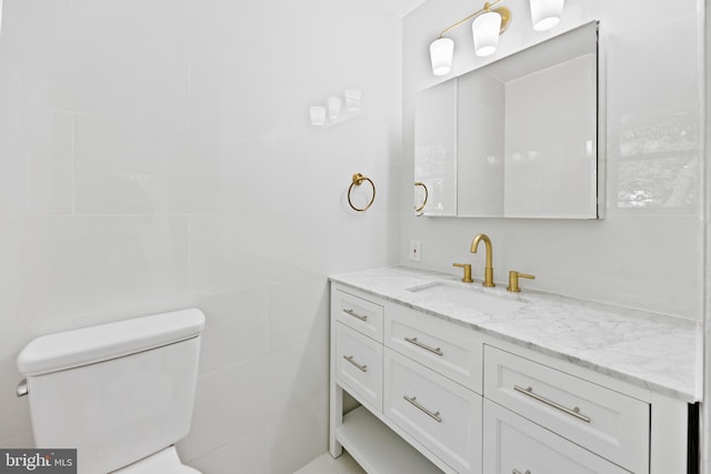 bathroom with toilet and vanity