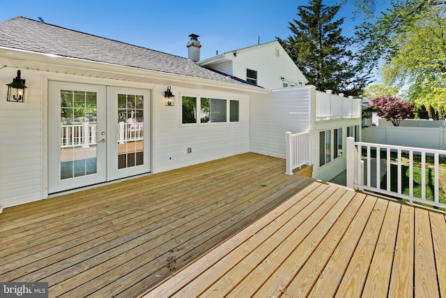 wooden deck with fence and french doors