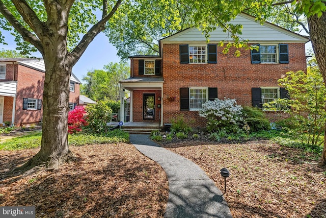 traditional home with brick siding