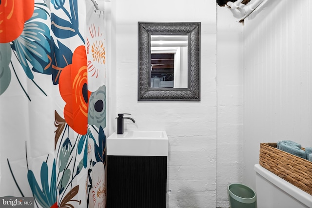 bathroom with vanity and toilet