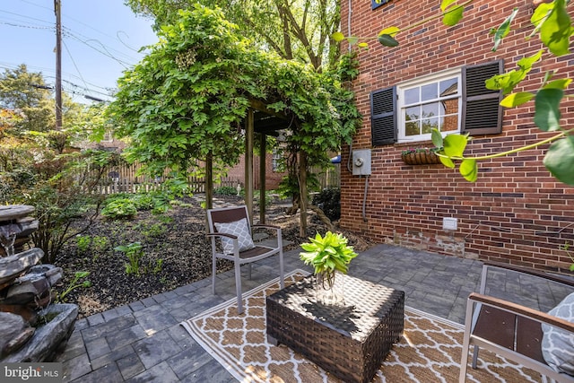 view of patio featuring fence