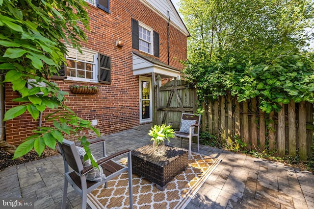 view of patio / terrace with fence and a gate