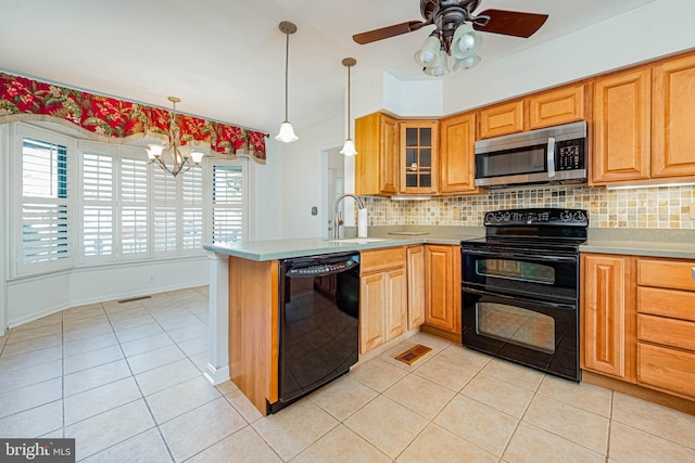 kitchen with black appliances, a sink, light tile patterned flooring, a chandelier, and a peninsula