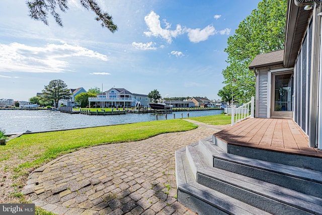view of patio featuring a residential view and a deck with water view
