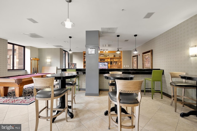 interior space with light tile patterned floors, pool table, baseboards, and wallpapered walls