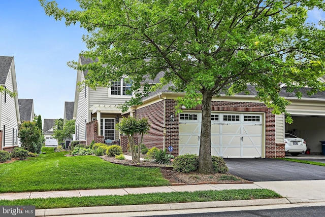 44365 Adare Manor Sq, Ashburn, VA 20147 - obstructed view of property featuring brick siding, driveway, a front yard, and an attached garage