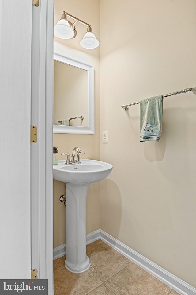 44365 Adare Manor Sq, Ashburn, VA 20147 - bathroom with baseboards, tile patterned floors, and a sink